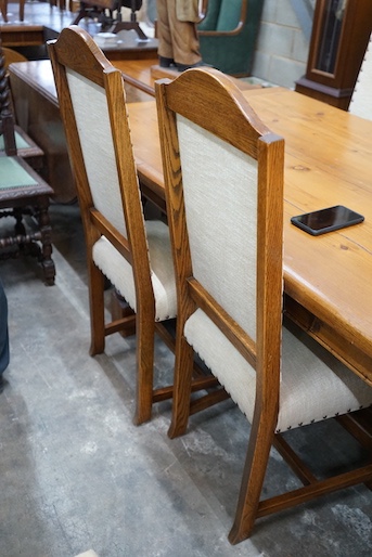 A set of six 18th century style oak dining chairs, with cream upholstered seats and backs